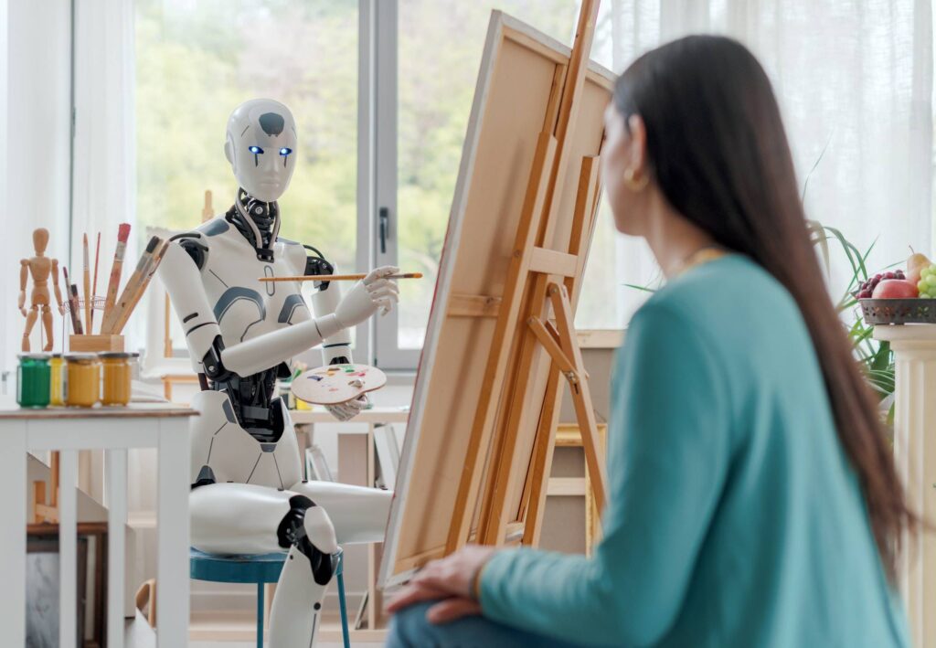 A humanoid robot paints on an easel while displaying a palette of colors, with art supplies and a creative workspace around it.