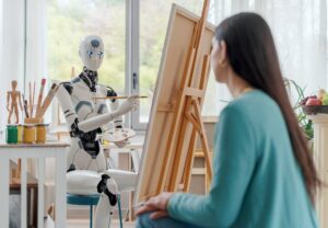 A humanoid robot paints on an easel while displaying a palette of colors, with art supplies and a creative workspace around it.