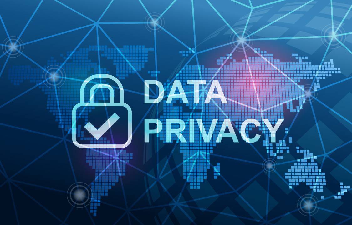  A blue digital backdrop featuring a world map, a locked padlock icon, and the text DATA PRIVACY emphasizing cybersecurity and personal data protection.