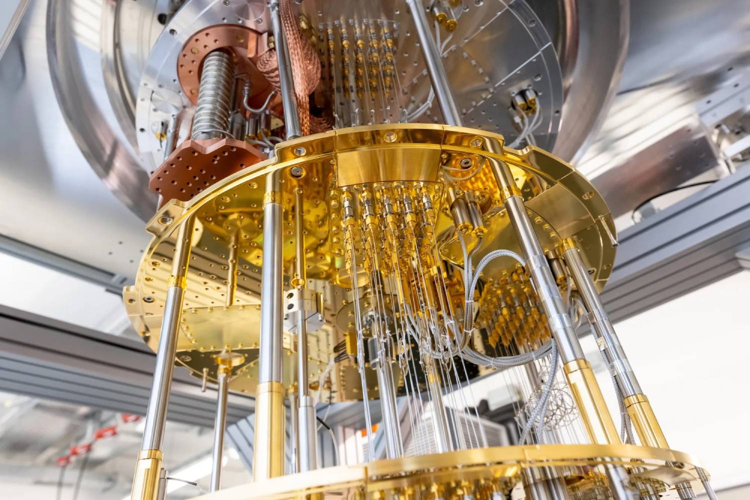  Close-up of a quantum computer's intricate, golden circuitry and cooling components, showcasing advanced technology in modern computing.