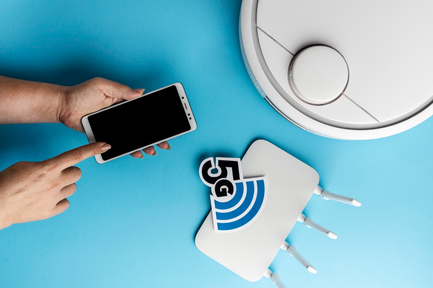 A hand points at a blank smartphone screen, next to a white robotic vacuum and a 5G router on a blue background.