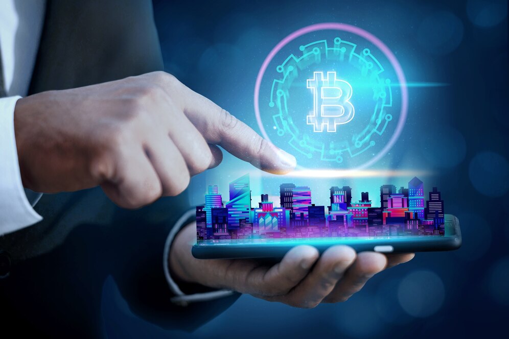 A business person's hand holds a smartphone displaying a vibrant city skyline, with a glowing Bitcoin symbol above it.