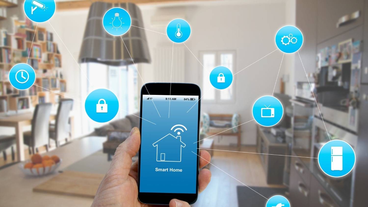 A person's hand holding a smartphone displaying a smart home app interface with icons representing connected home functionalities.