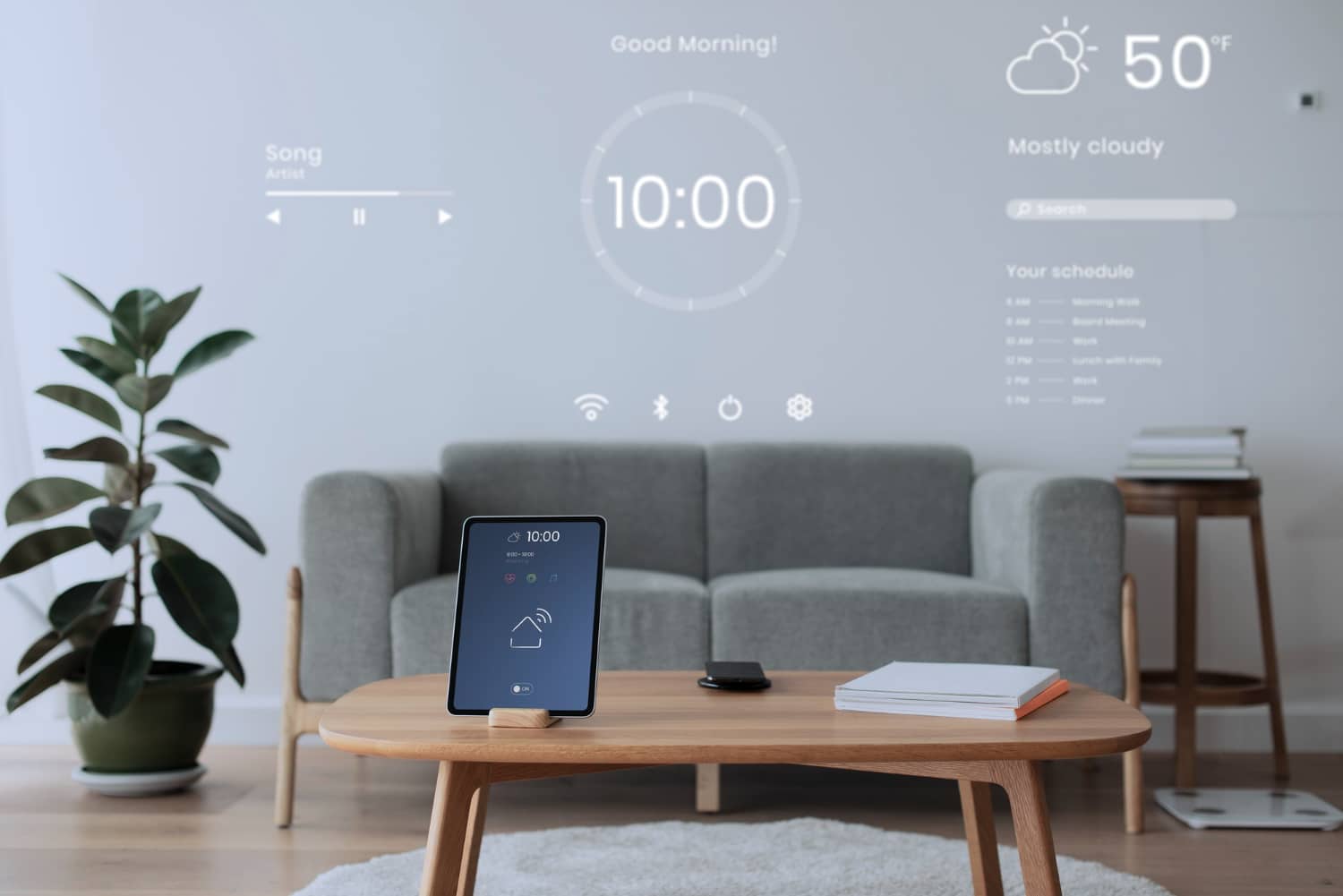 Modern living room featuring a digital display with a time and weather projection on the wall, a smart tablet on a wooden table.