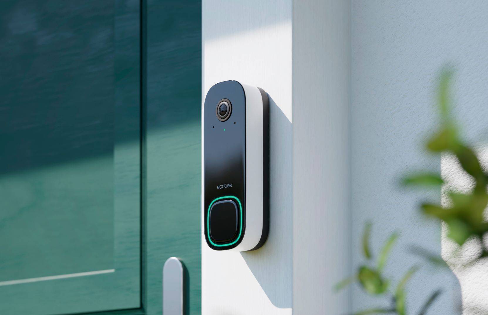 A modern Ecobee smart doorbell camera mounted on a white wall beside a green door, showcasing its sleek design and functionality.