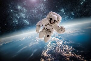 An astronaut floating in space, with Earth below and a starry sky above, embodies the vastness of the universe.