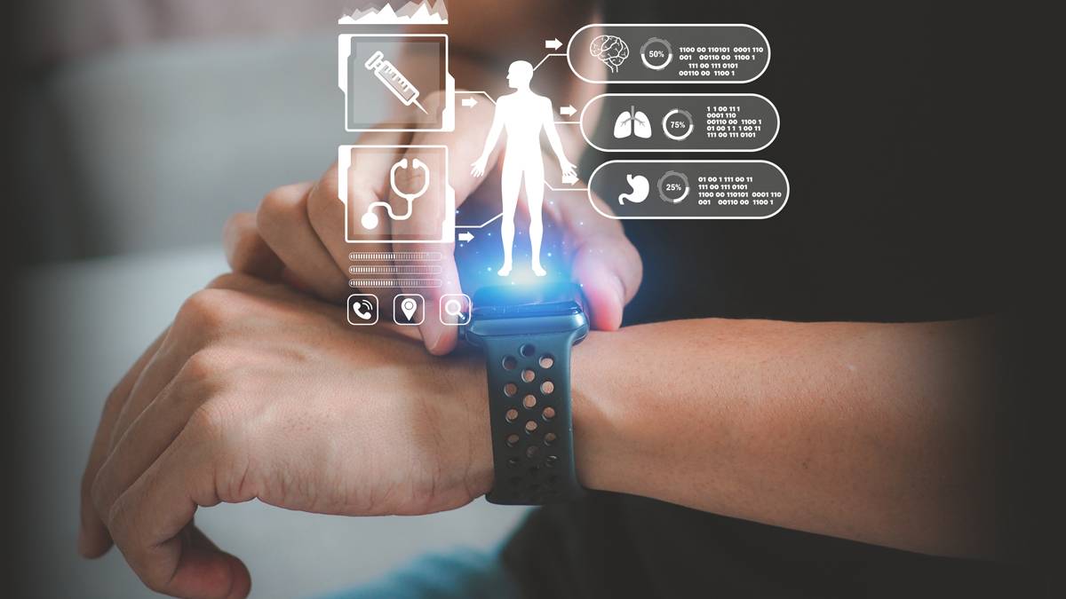  A person holding a smart watch displaying a colorful digital interface with various apps and notifications visible.