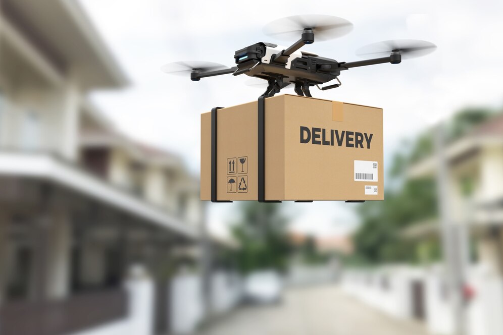 A drone carries a large delivery box labeled DELIVERY over a blurred residential street.