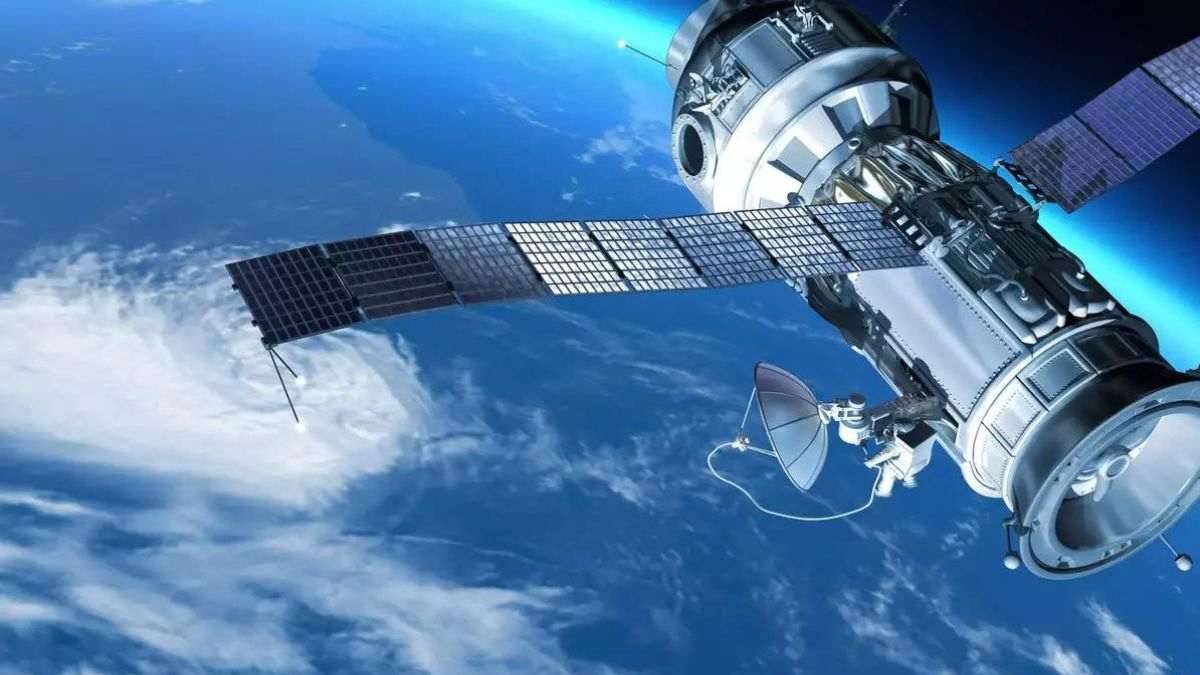 A detailed view of a satellite in space, featuring solar panels and communication dishes against a backdrop of Earth and clouds.