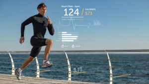 A person wearing athletic gear runs near a waterfront, with workout stats displayed, including heart rate and calories burned.